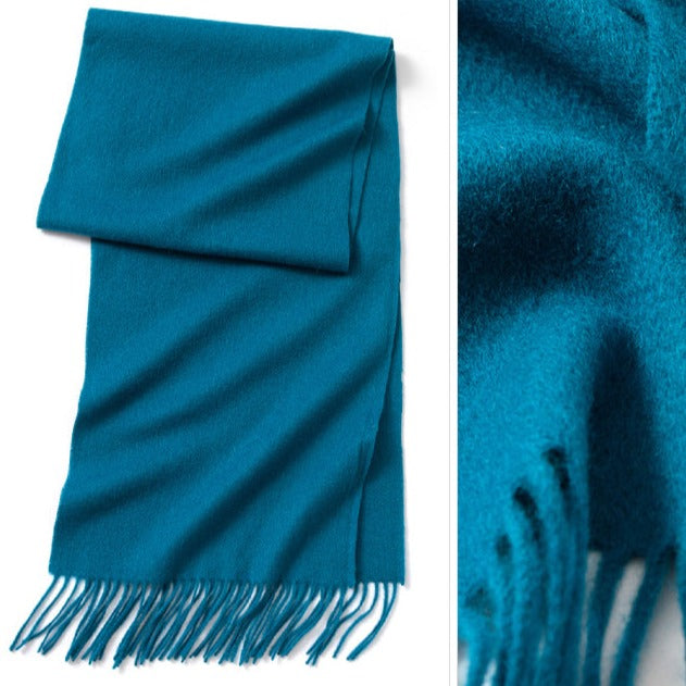 Peacock Blue wool scarf || The scarf is made from high-quality merino wool, ensuring maximum warmth and comfort on even the coldest days. The generous length provides ample coverage, while the tassels add a touch of personality and charm to your outfit.  Available in 12 vibrant and earthy colors, our wool scarf is perfect for adding a pop of color to any outfit. From classic neutrals to bold and bright shades, there's a color to suit every taste and style.
