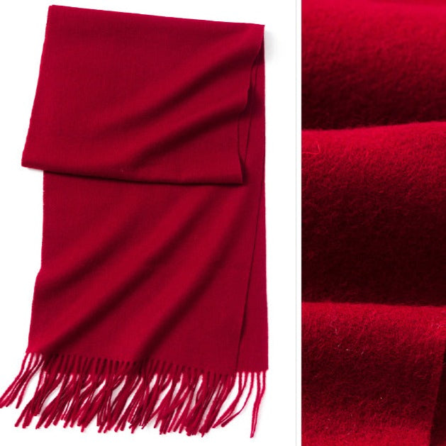 Cranberry red scarf | The scarf is made from high-quality merino wool, ensuring maximum warmth and comfort on even the coldest days. The generous length provides ample coverage, while the tassels add a touch of personality and charm to your outfit.  Available in 12 vibrant and earthy colors, our wool scarf is perfect for adding a pop of color to any outfit. From classic neutrals to bold and bright shades, there's a color to suit every taste and style.
