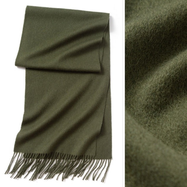 Olive green wool scarf | The scarf is made from high-quality merino wool, ensuring maximum warmth and comfort on even the coldest days. The generous length provides ample coverage, while the tassels add a touch of personality and charm to your outfit.  Available in 12 vibrant and earthy colors, our wool scarf is perfect for adding a pop of color to any outfit. From classic neutrals to bold and bright shades, there's a color to suit every taste and style.