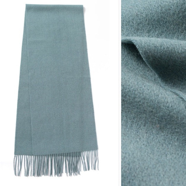 Turquoise Green Scarf | The scarf is made from high-quality merino wool, ensuring maximum warmth and comfort on even the coldest days. The generous length provides ample coverage, while the tassels add a touch of personality and charm to your outfit.  Available in 12 vibrant and earthy colors, our wool scarf is perfect for adding a pop of color to any outfit. From classic neutrals to bold and bright shades, there's a color to suit every taste and style.