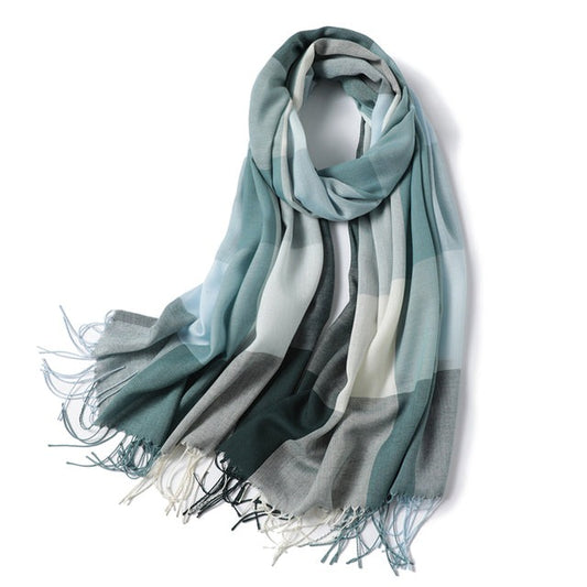 Stay cozy and stylish all year round with our large woollen plaid scarf. Made from a lightweight viscose blend, this scarf is perfect for transitional and summer seasons, providing a comfortable and fashionable accessory for any outfit.  The plaid design adds a classic and timeless touch to your look, while the soft and lightweight material keeps you warm without weighing you down. This scarf is perfect for layering over your favorite outfits, adding a touch of warmth and style to any ensemble.