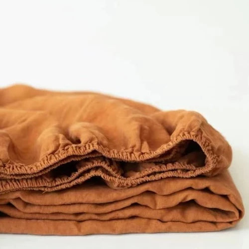 Terracotta linen bedding | Upgrade your bedding with our high-quality linen fitted sheet and experience the ultimate in comfort and luxury. Order now and create a cozy and inviting space that you'll love to come home to.