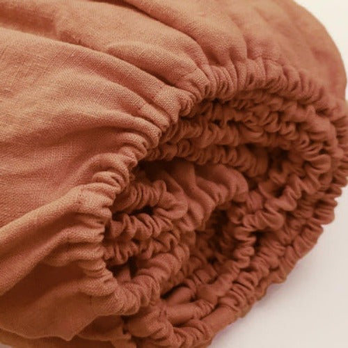 Terracotta linen fitted sheets | Easy to care for, our linen fitted sheets can be machine washed and tumble dried, and they become even softer and more comfortable over time. With a range of colors available, you can mix and match different linen fitted sheets to create a unique and personalized look for your bed.