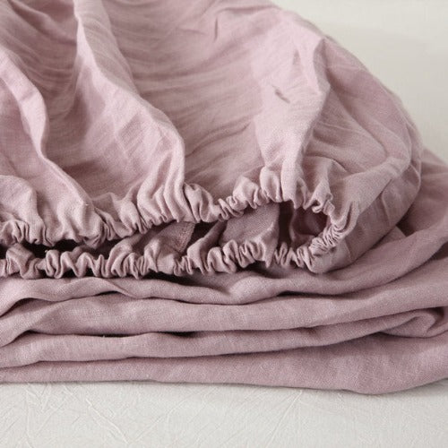 Dusty Mauve fitted linen sheet | Easy to care for, our linen fitted sheets can be machine washed and tumble dried, and they become even softer and more comfortable over time. With a range of colors available, you can mix and match different linen fitted sheets to create a unique and personalized look for your bed.
