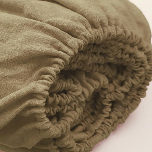 Olive green fitted sheet | Easy to care for, our linen fitted sheets can be machine washed and tumble dried, and they become even softer and more comfortable over time. With a range of colors available, you can mix and match different linen fitted sheets to create a unique and personalized look for your bed.