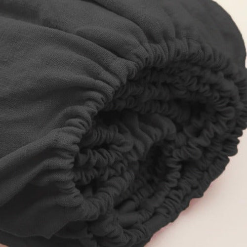 Black linen fitted sheet | Easy to care for, our linen fitted sheets can be machine washed and tumble dried, and they become even softer and more comfortable over time. With a range of colors available, you can mix and match different linen fitted sheets to create a unique and personalized look for your bed.