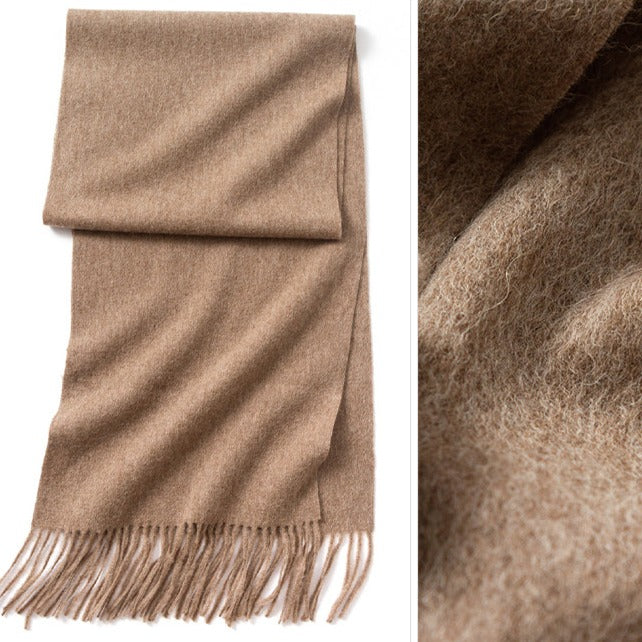 Taupe wool scarf | Stay cozy and stylish this season with our 100% merino wool scarf. This scarf is not only soft and warm, but also long and stylish, with tassels that add a playful and chic touch.