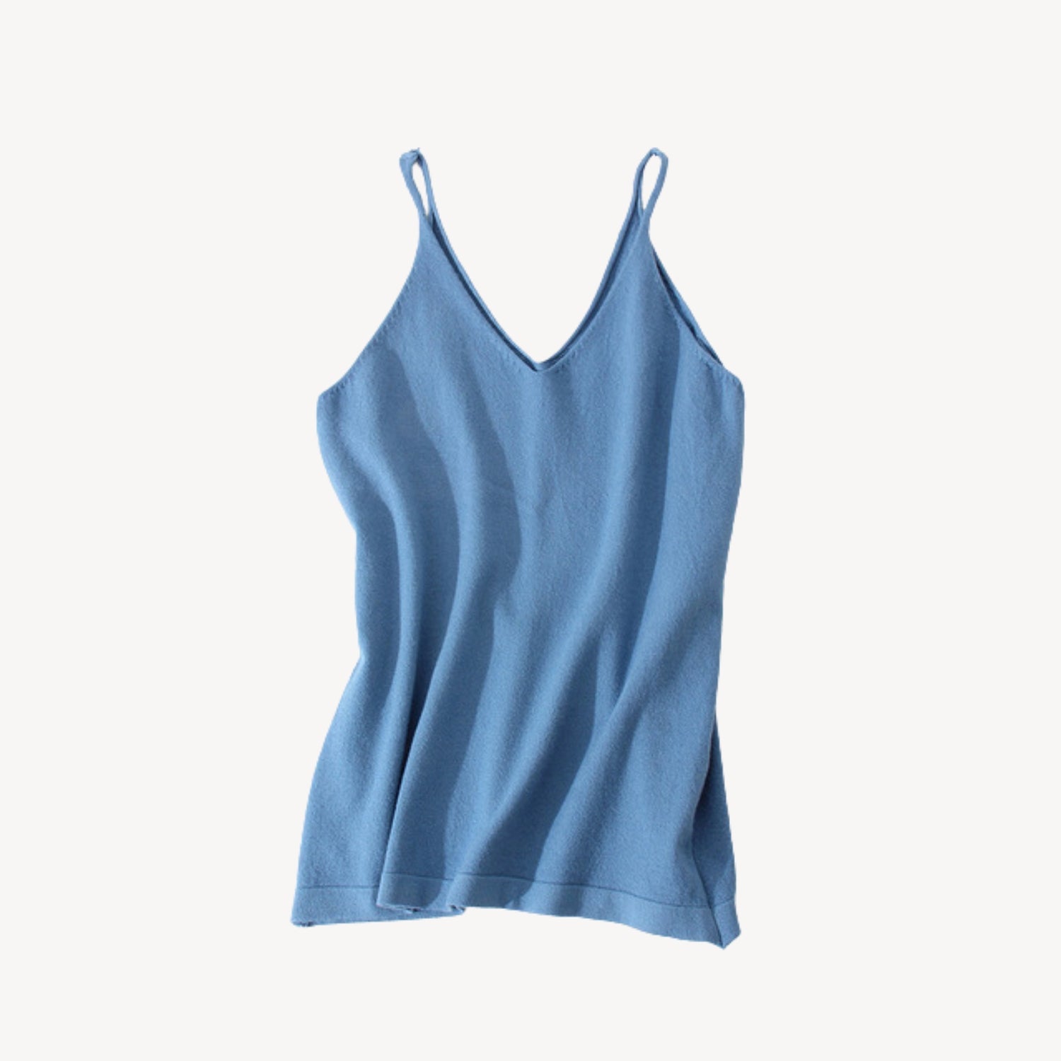 Blue wool tank top | Whether you're heading to the beach or running errands around town, our knit jersey tank top is a must-have for any summer wardrobe. Its timeless style ensures that it will be a wardrobe staple for years to come, while its soft and lightweight material makes it a comfortable choice for everyday wear.