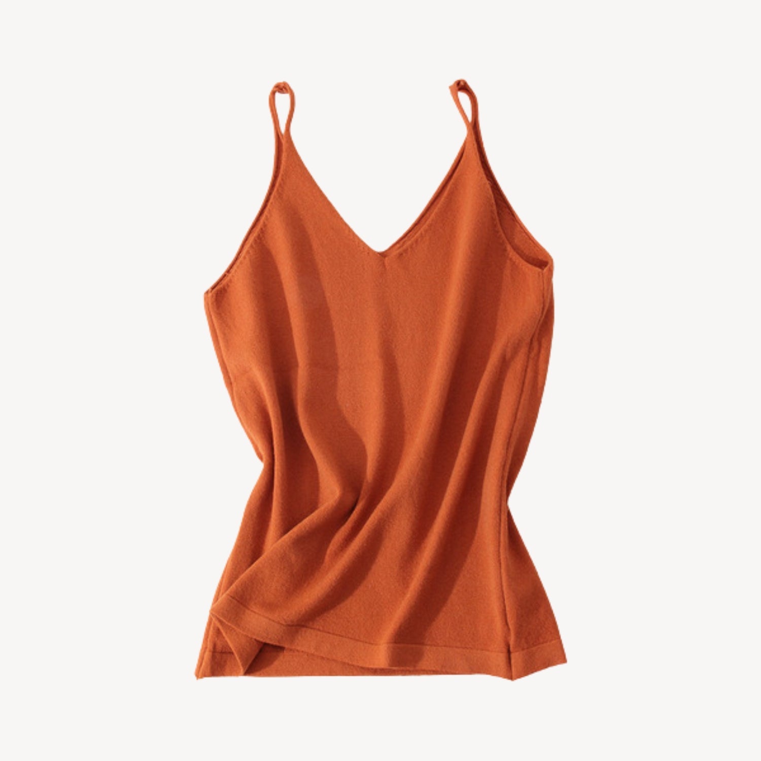 Rust wool tank top | Whether you're heading to the beach or running errands around town, our knit jersey tank top is a must-have for any summer wardrobe. Its timeless style ensures that it will be a wardrobe staple for years to come, while its soft and lightweight material makes it a comfortable choice for everyday wear.