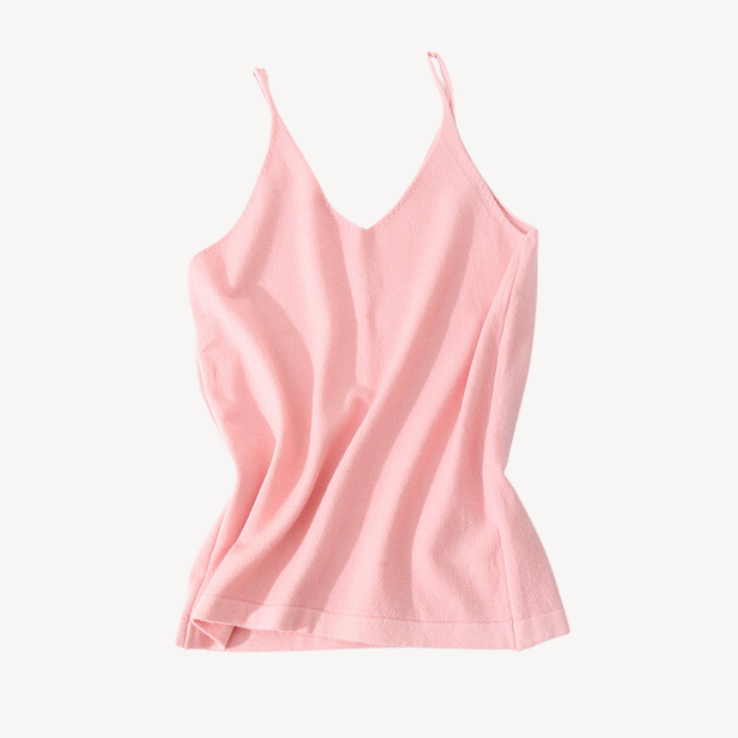 Pink wool tank top | Whether you're heading to the beach or running errands around town, our knit jersey tank top is a must-have for any summer wardrobe. Its timeless style ensures that it will be a wardrobe staple for years to come, while its soft and lightweight material makes it a comfortable choice for everyday wear.
