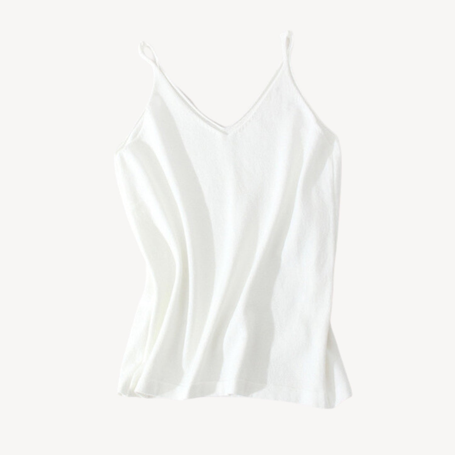 White wool tank top | Whether you're heading to the beach or running errands around town, our knit jersey tank top is a must-have for any summer wardrobe. Its timeless style ensures that it will be a wardrobe staple for years to come, while its soft and lightweight material makes it a comfortable choice for everyday wear.