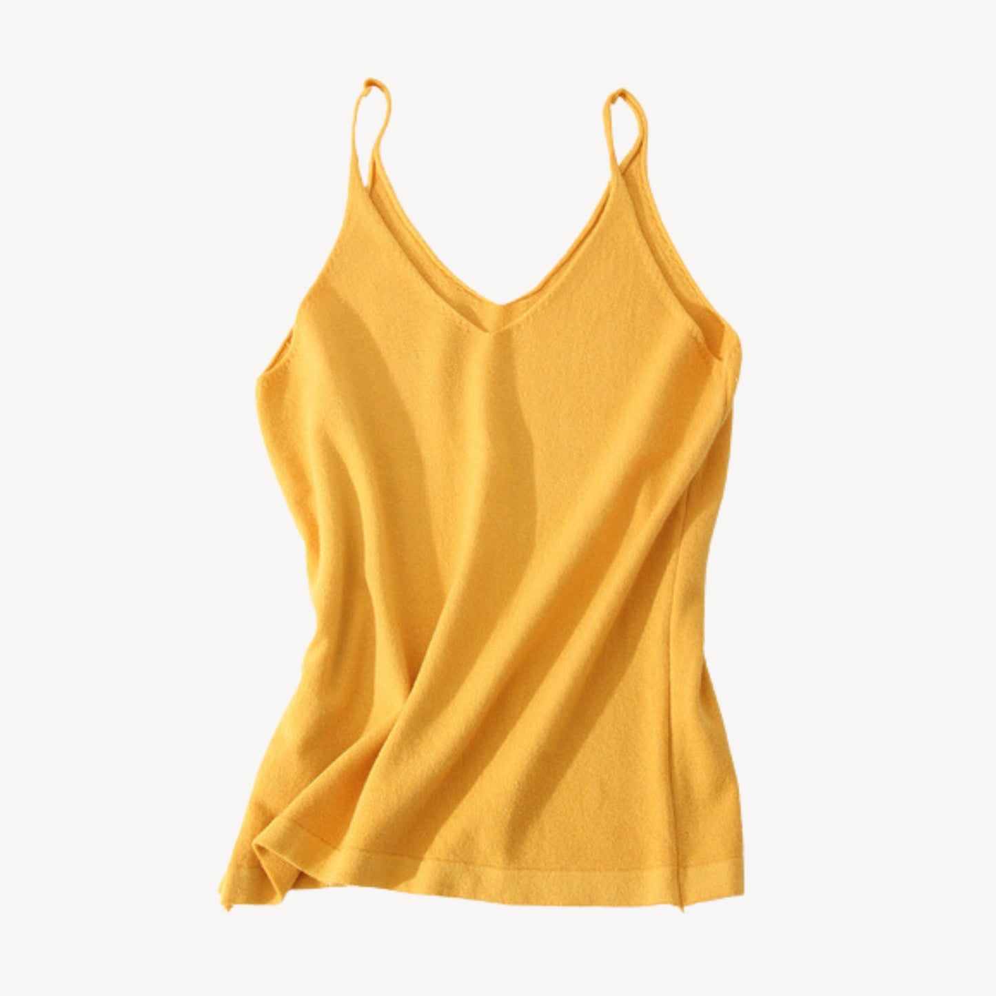 Mustard wool tank top | Whether you're heading to the beach or running errands around town, our knit jersey tank top is a must-have for any summer wardrobe. Its timeless style ensures that it will be a wardrobe staple for years to come, while its soft and lightweight material makes it a comfortable choice for everyday wear.